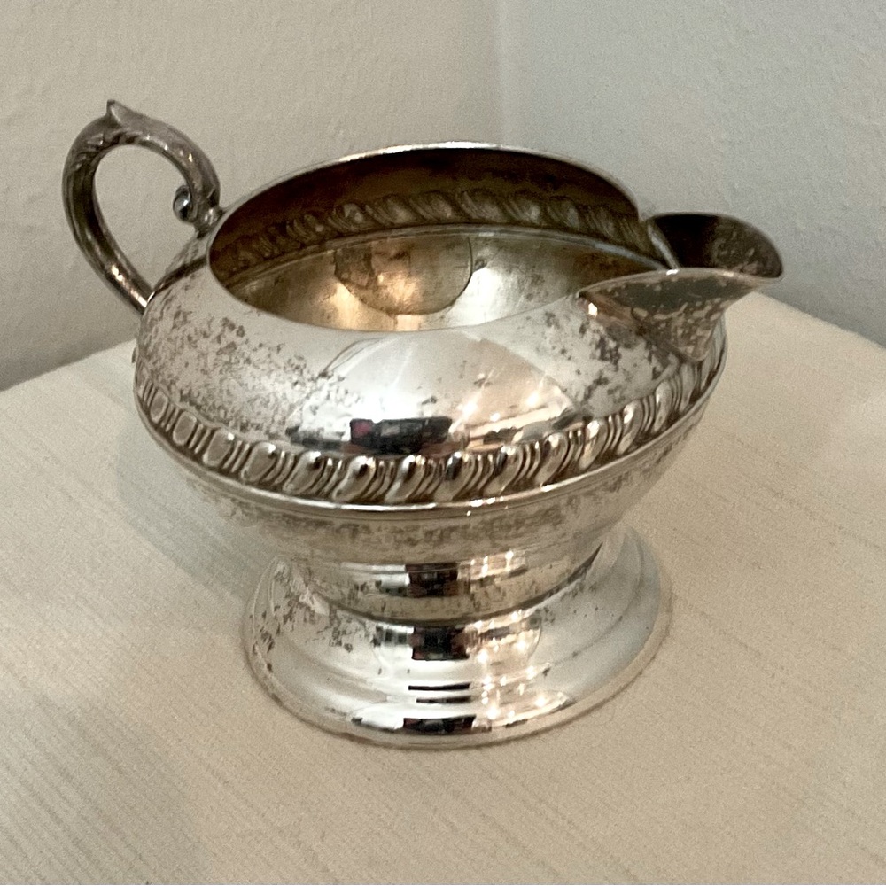 Silver-plated jug for milk, cream.  Silver metal jug.